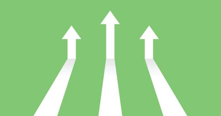 Digital Marketing Trends to Watch in 2023 Vector illustration image of white arrows on green background coming in and pointing up to depict increasing trends. Specifically, indicating the topic of the blog post which is digital trends in 2023.